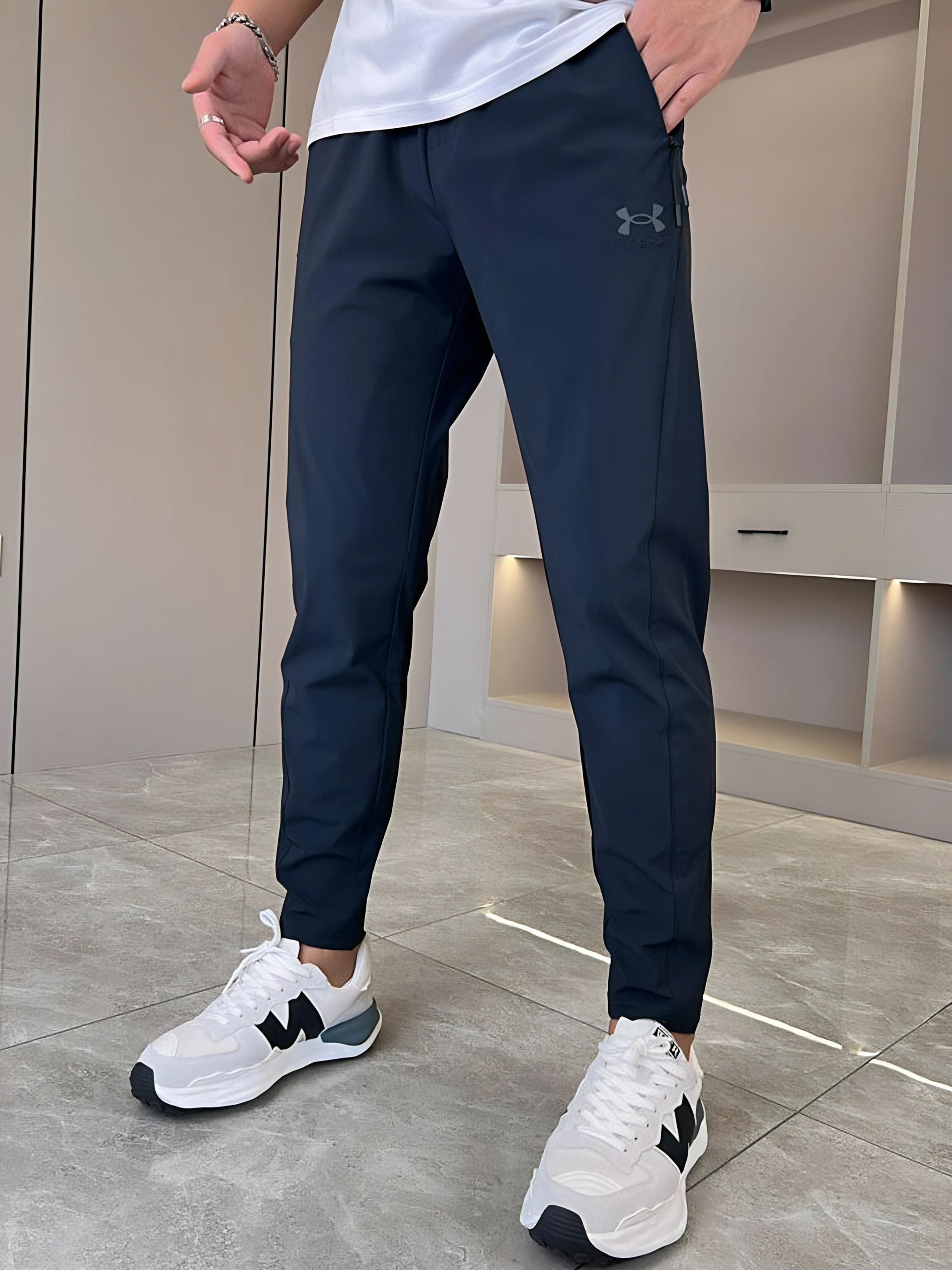 Under Armour - Pantaloni originali asciutti super elasticizzati unisex